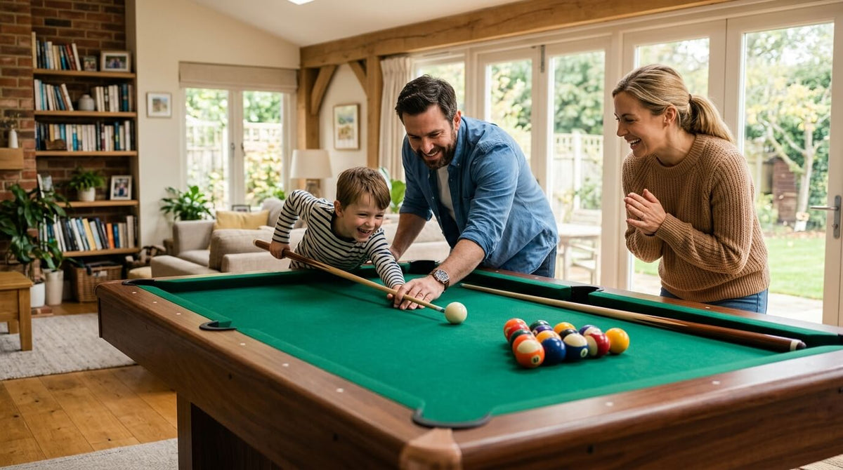 Parents helping their young son take a shot on the family's first pool table