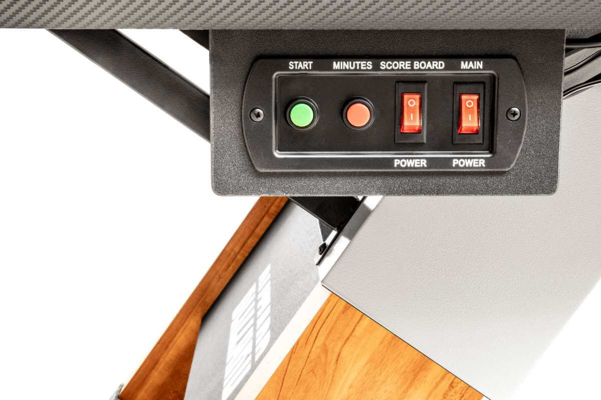 Close-up of the power switch and electronic scorer control panel on the Dybior Blizzard air hockey table.