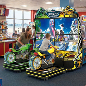 Bikers Madness motorbike arcade machine in a UK seaside arcade with a child playing while a parent watches