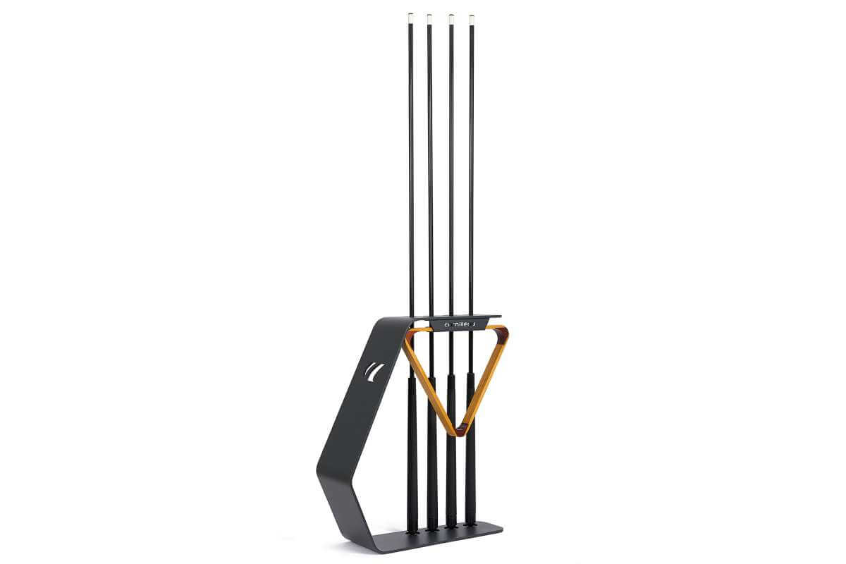 Cornilleau cue stand accessory shown beside the outdoor pool table in Charcoal Grey frame, alternate angle