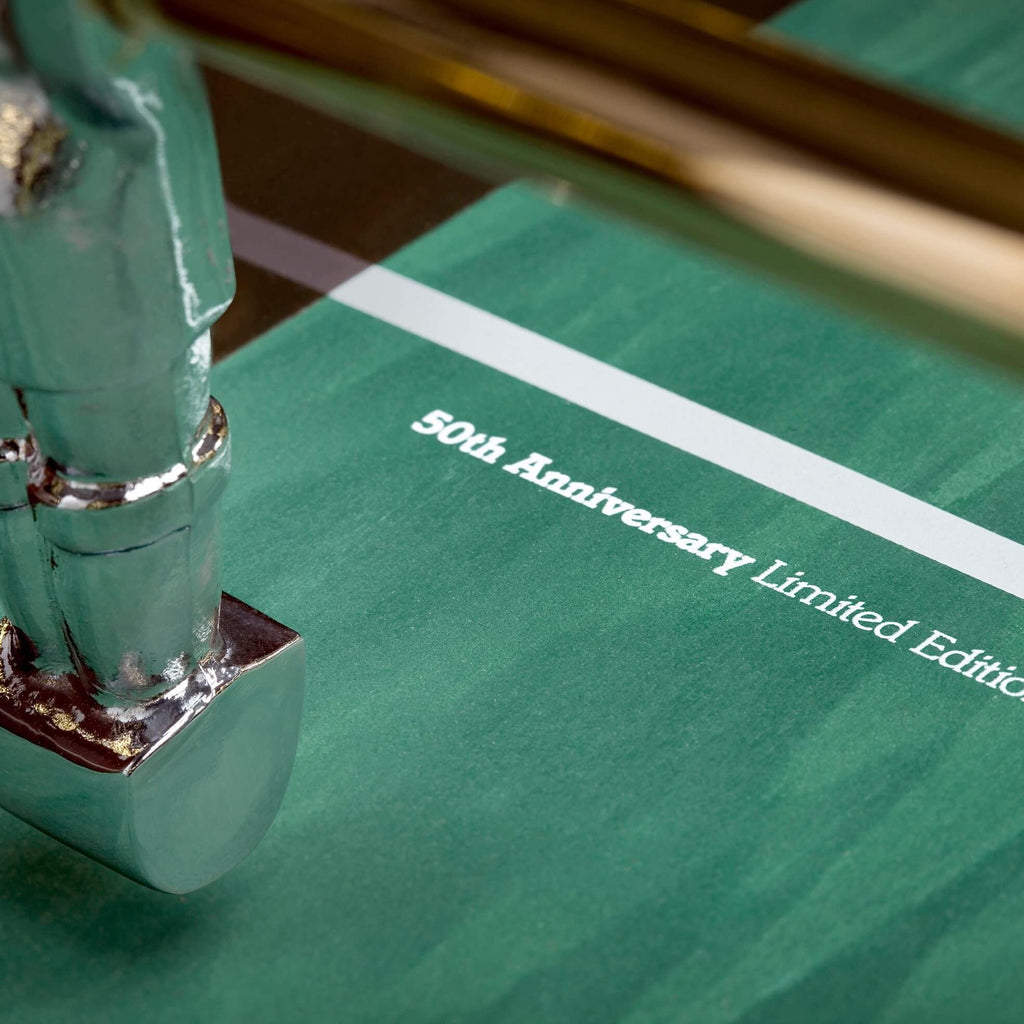 50th anniversary lettering printed on the green B50 pitch beside a chrome player