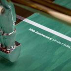 50th anniversary lettering printed on the green B50 pitch beside a chrome player