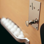 Chrome coin slot and ball window on the side of the B60 beech cabinet