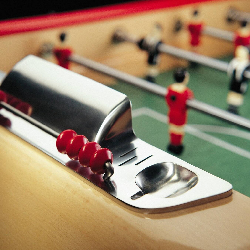 Chrome ball return tray at the end of the B60 pitch with red players