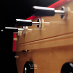 Chrome rods and black handles along the side of the B60 football table