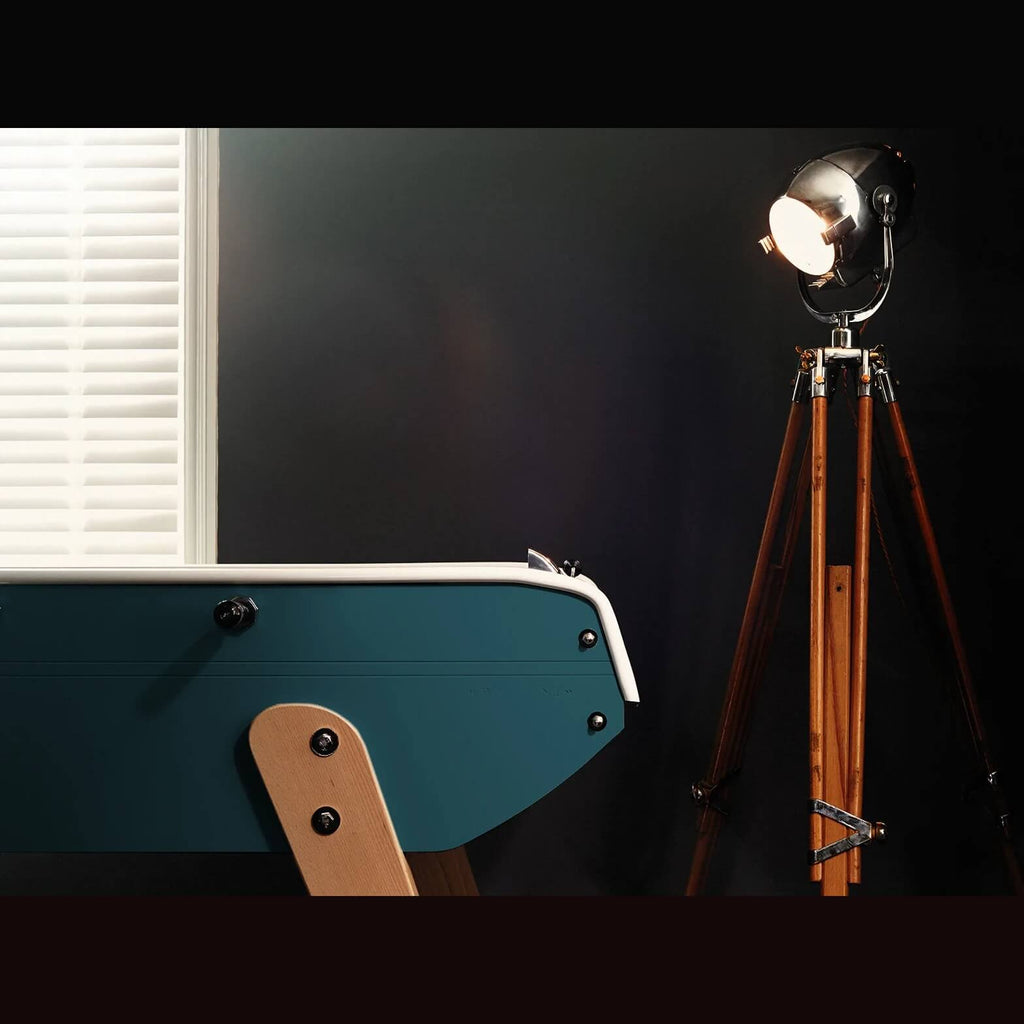 Teal Eames inspired B90 football table end with beech leg in a dark room