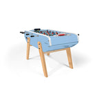 Sky blue Eames inspired B90 football table with splayed beech legs on a white background