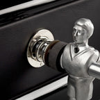 Chrome player and rod bearing against the black leather cabinet