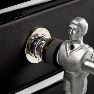 Chrome player and rod bearing against the black leather cabinet