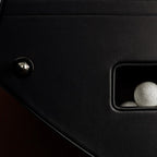 Ball return opening in the black leather side of the B90 football table