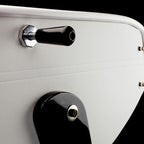 Black handle against the white leather side of the B90 football table