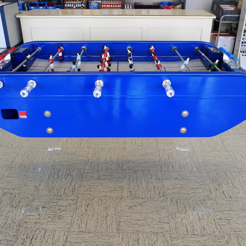 Side view of the blue B90 football table on clear Perspex legs