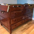 Cherry wood Grand Tiroirs football table showing its bank of drawers in a home