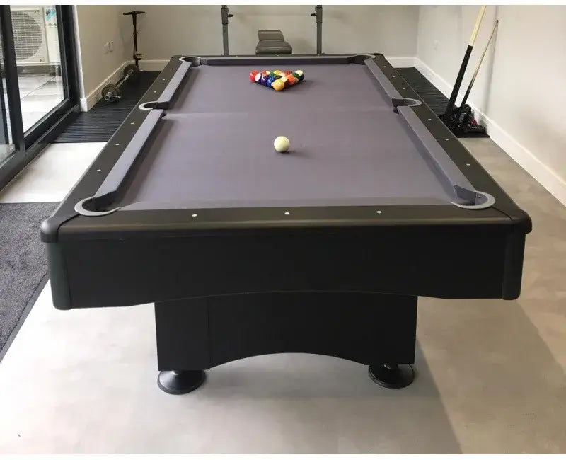 Buffalo Eliminator II Stealth pool table with balls racked in a modern room