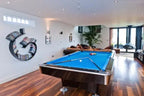 Buffalo Pro II pool table with blue cloth in a bright games room