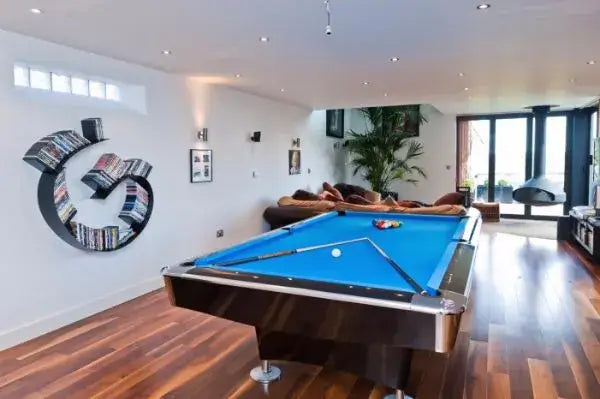 Buffalo Pro II pool table with blue cloth in a bright games room