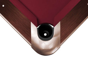 Close-up of an inset corner pocket on the mahogany Dynamic Competition II 9ft pool table