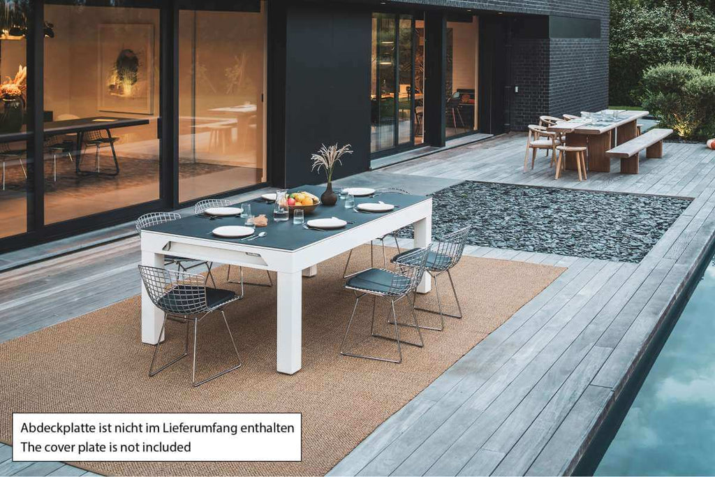 Cornilleau Classic Outdoor Pool Dining Table in White frame outdoors, further angle showing the table in its setting
