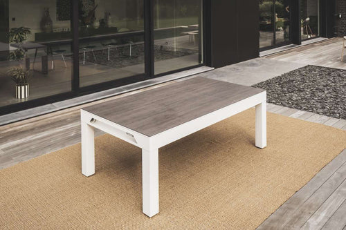 Cornilleau Classic Outdoor Pool Dining Table in White frame with the standard dining tabletop fitted over the playing surface
