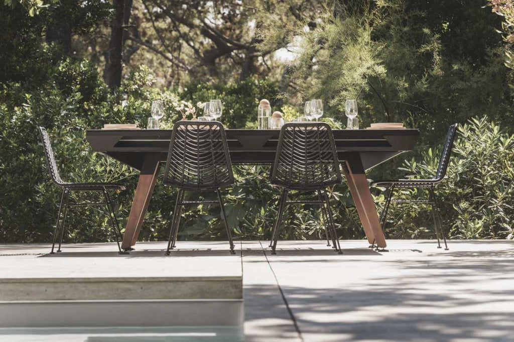 Black Cornilleau Origin pool table with the dining top fitted, shown set up as a dining table