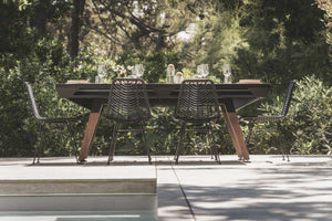 Black Cornilleau Origin pool table with the dining top fitted, shown set up as a dining table