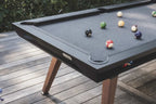Black Cornilleau Origin outdoor pool table set up outside on a patio