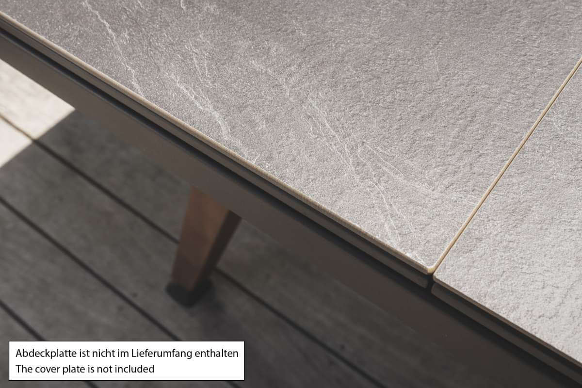 Black Cornilleau Origin outdoor pool table with the Stone Design dining top plate fitted