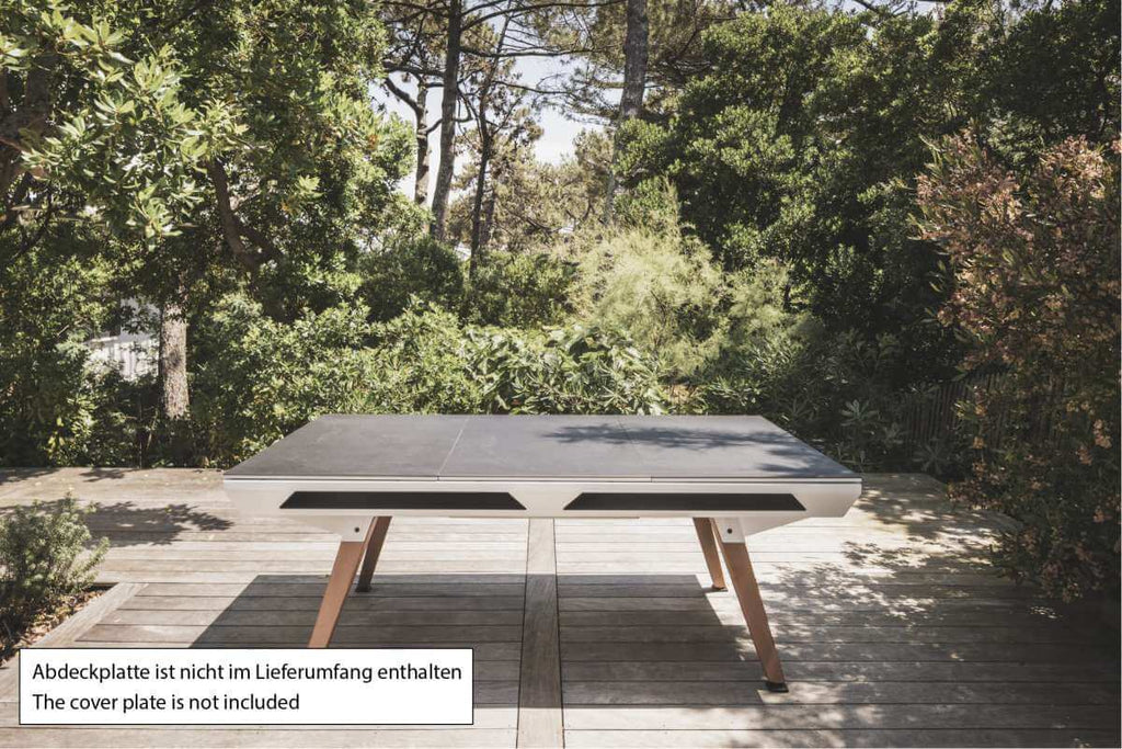 White Cornilleau Origin outdoor pool table positioned outdoors, alternate angle