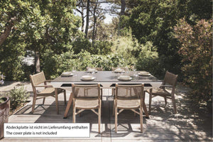 White Cornilleau Origin outdoor pool table set up outside on a patio