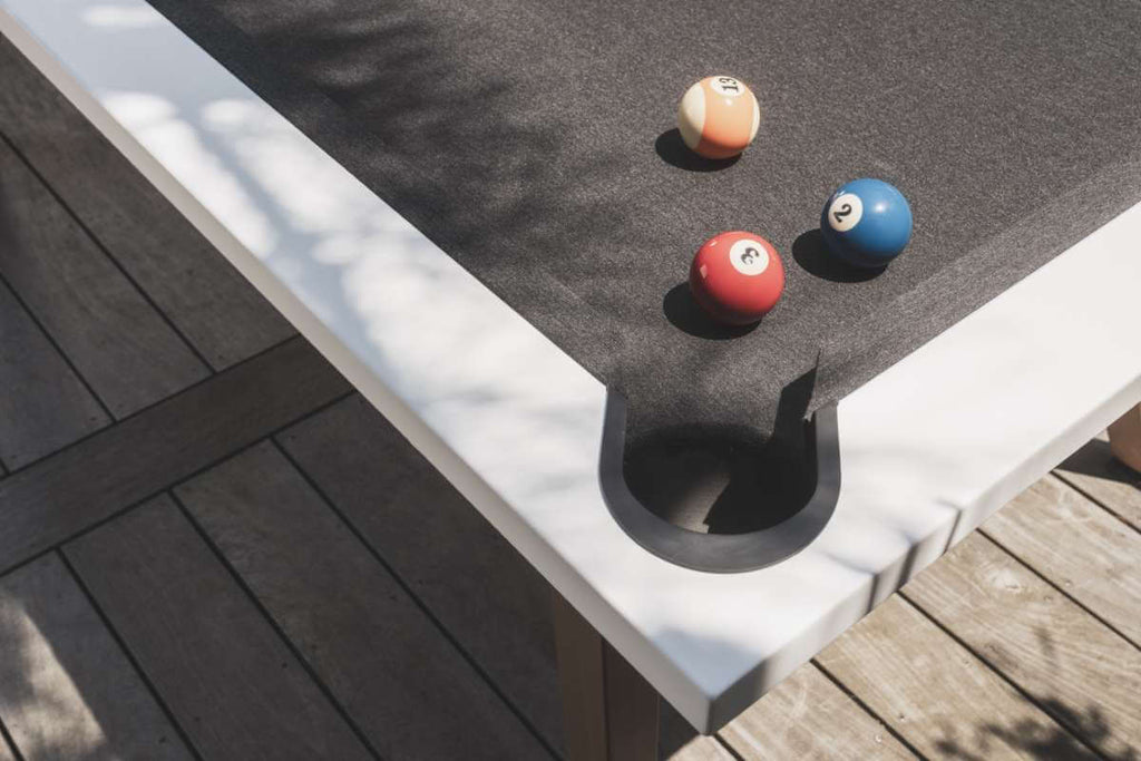 White Cornilleau Origin outdoor pool table racked up with balls ready to play