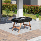 Cornilleau Origin black football table on a garden patio