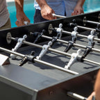 Players at the Cornilleau Origin black football table