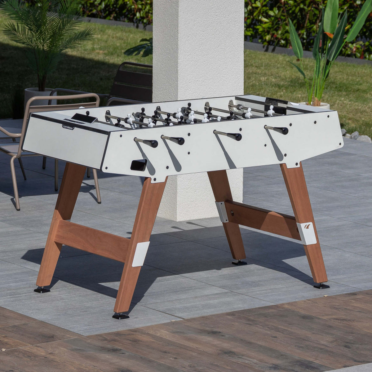 Cornilleau Origin white football table on a garden patio