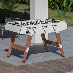 Cornilleau Origin white football table on a garden patio