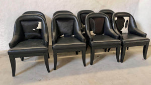 Set of black leather poker chairs with black and white cowhide backs