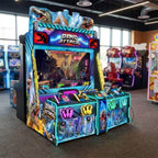 Dino Attack arcade machine glowing in a family entertainment centre