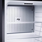 Inside the minibar showing the control panel and glass shelf