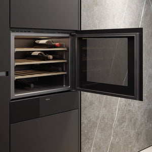 Veritas BI24 with the door open showing wine bottles on oak shelves