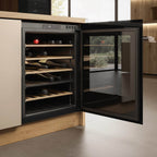Veritas BI36 with the door open showing wine bottles on six oak shelves