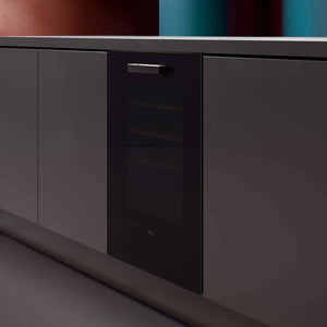 Veritas BI36 black glass front set into dark kitchen units