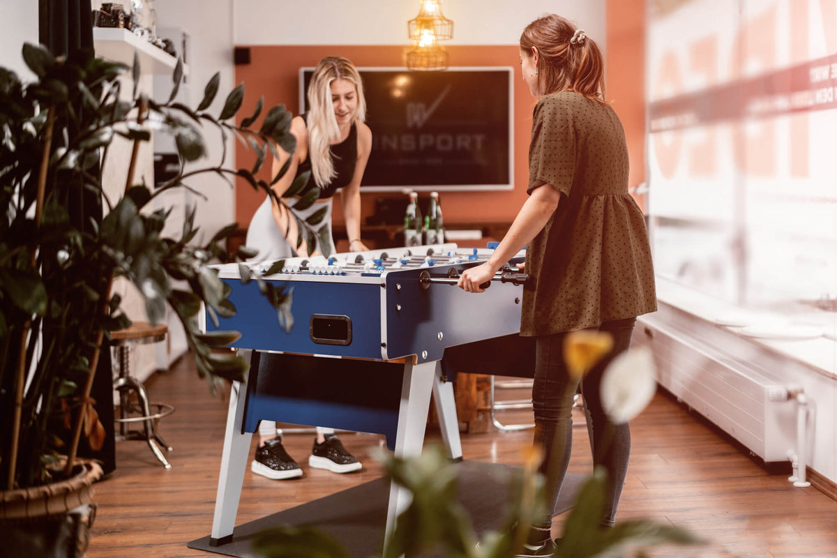 People playing on the Garlando Master Cup Foldy football table