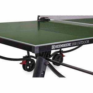 Edge trim and wheel of the green Heemskerk 2300 outdoor table tennis table