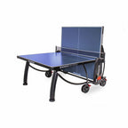 Blue Heemskerk 2300 outdoor table tennis table with one half raised for solo practice