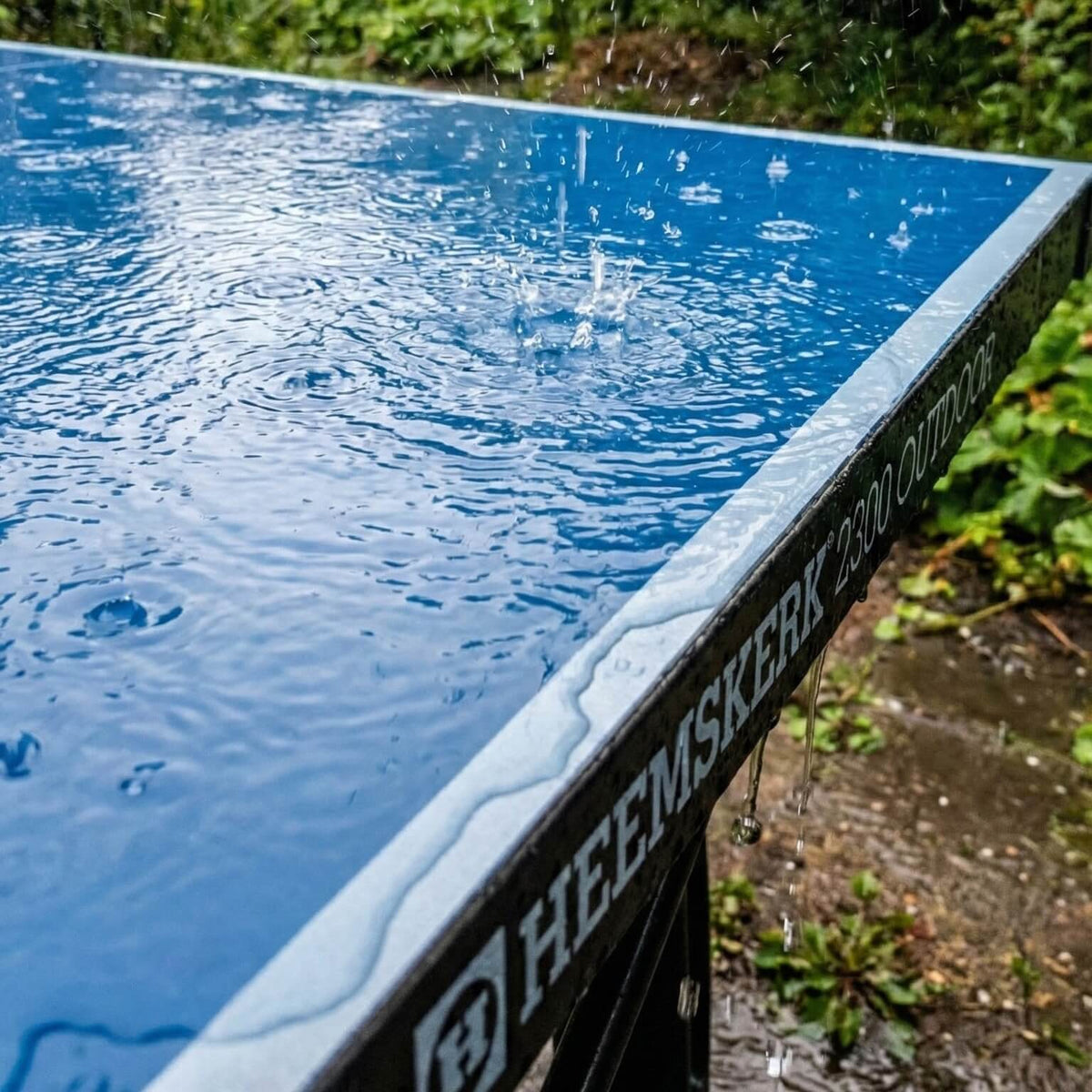 Rain on the blue top of a Heemskerk 2300 outdoor table tennis table