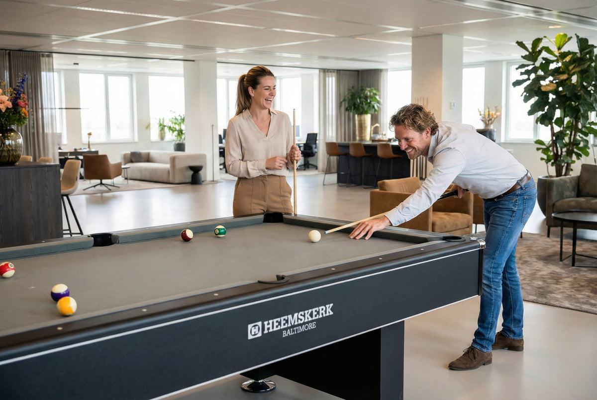 Colleagues playing pool on a Heemskerk Baltimore with grey cloth in an open-plan office