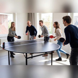 Five people playing on a Heemskerk Circle round table tennis table in an office