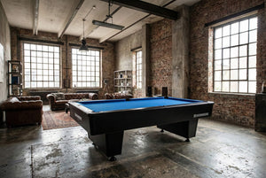 Heemskerk Dallas pool table with blue cloth in an industrial-style loft