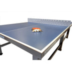 Bats and balls on the blue top of a Heemskerk Delta outdoor table tennis table
