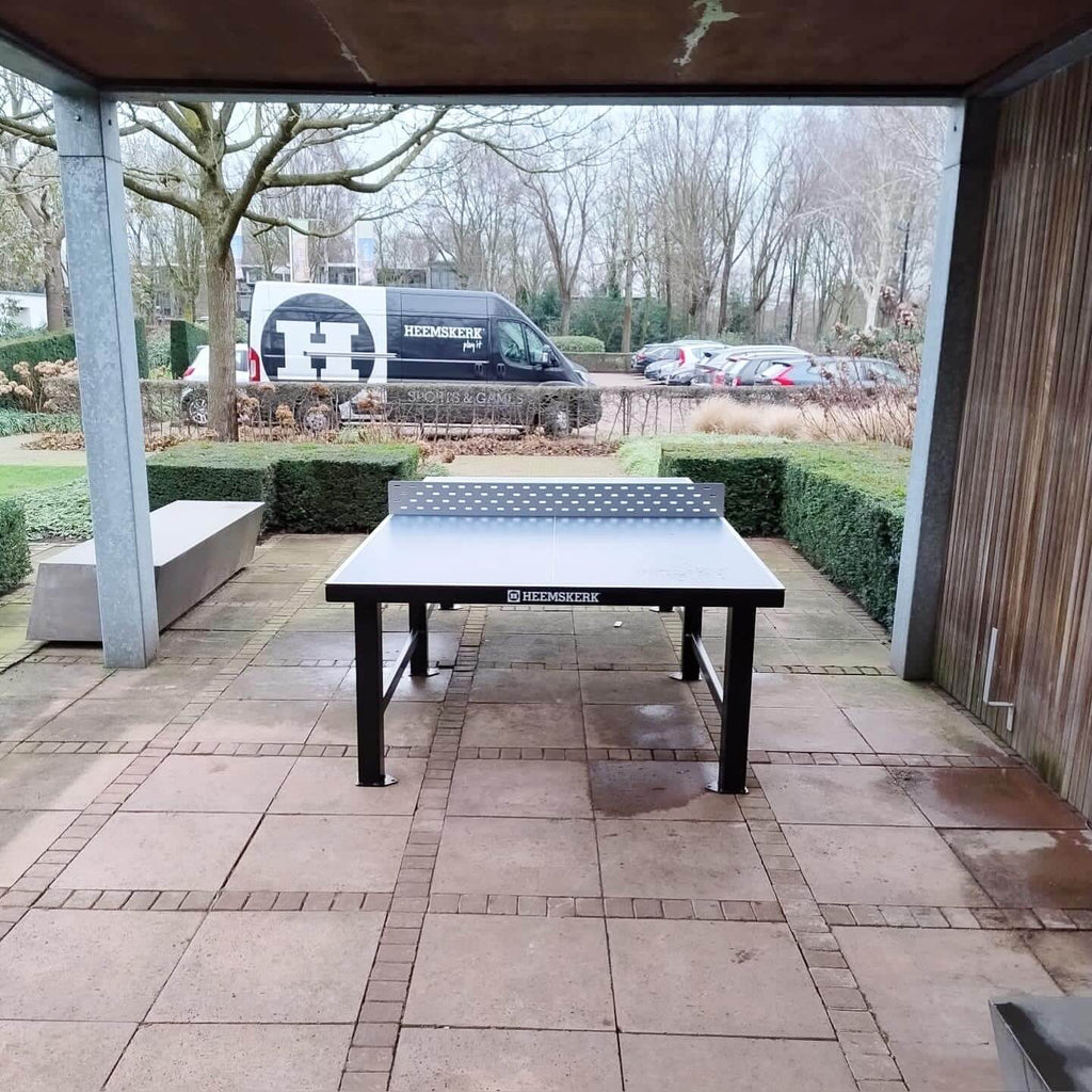 Heemskerk Delta outdoor table tennis table under a covered shelter in a park