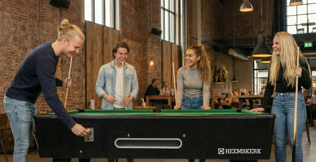 Group of friends paying for a game at the side of a Kick Shot pool table in a bar